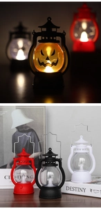 Close-up of Halloween LED lanterns in red, black, and white with warm light glow
