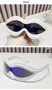 Macro detail of Y2K sunglasses with white wavy frame and blue translucent lenses