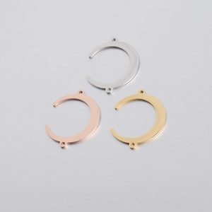 Detailed view of crescent moon stainless steel connectors in silver, rose gold, and gold