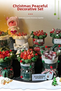 Close-up of red and green plaid floral wrapping sheets with Merry Christmas ribbons