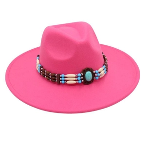 Detail of rose pink wide brim fedora with bohemian turquoise and beaded hat band decoration