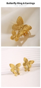 Macro detail of golden butterfly jewelry set featuring earrings and ring on white silk