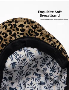 Detailed view of leopard print cotton hat with breathable black sweatband and floral lining