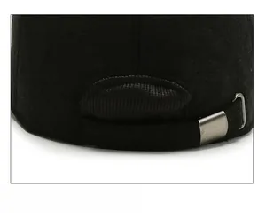 Close-up of adjustable metal buckle and wool texture on back of winter baseball cap