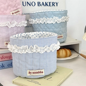 Pastel quilted heart storage baskets with lace trim in pink and blue floral style