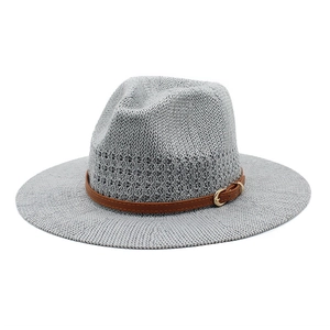 Detail of light gray knitted fedora featuring a brown leather belt with golden buckle