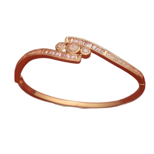 Elegant gold-plated bangle for women featuring rectangular and round zirconia crystals