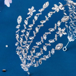 Luxurious bridal headband featuring silver metal frame and sparkling rhinestone crystals