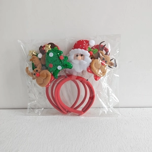 Detail of 4pcs Christmas headband set in transparent packaging featuring Santa and reindeer