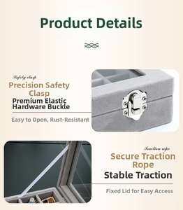 Detail of grey velvet jewelry box showing metal safety buckle and inner fixed cord