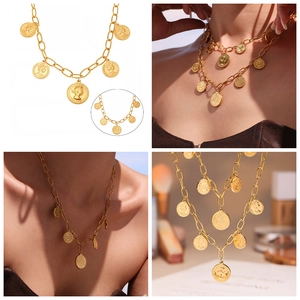 Detail of vintage gold chunky chain necklace featuring five embossed coin pendants on model