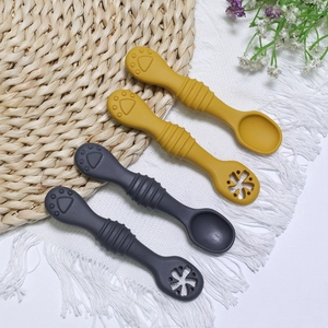 Silicone baby feeding spoons set for toddlers in ginger and grey colors with textured handles