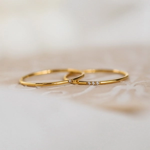 Slim gold-plated titanium steel rings set with minimalist cubic zirconia accents