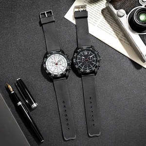 Detail of men's mesh strap sport watches with luminous dials on a textured background