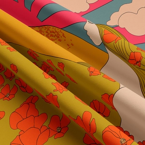 Close-up of bohemian woven tapestry fabric showing red floral and mustard yellow patterns