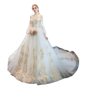 Elegant off-shoulder wedding dress with gold floral embroidery and long train sleeves