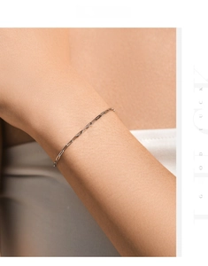 Close-up of minimalist s925 silver paperclip chain bracelet on a female wrist
