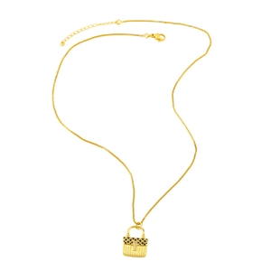 Golden handbag pendant necklace with black enamel checkered pattern and sparkling crystals
