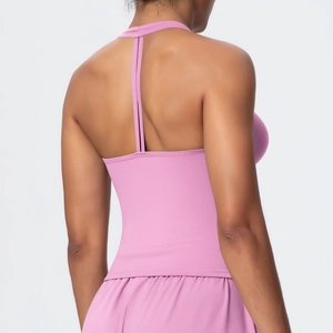 Rear view of pink high-stretch yoga bra and shorts showing back straps and ergonomic fit