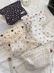 Floral and cartoon quilted makeup bags made of soft textured fabric for travel
