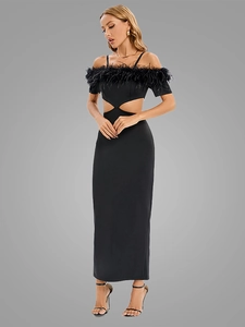 Detail of elegant black off-shoulder dress featuring premium feather trim and waist cutouts