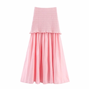 Detail of pink knit bodice and pleated chiffon skirt texture on the splicing dress