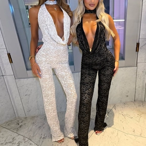 Detailed close-up of lace texture on backless halter V-neck jumpsuits in black and white