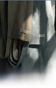 Detailed macro view of soft breathable cotton fabric texture and minimalist woven label