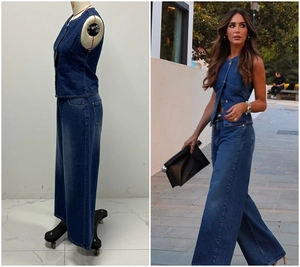 Detail of dark blue denim set featuring a sleeveless vest and high-waisted wide-leg jeans