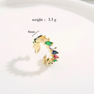 Close-up of golden adjustable ring featuring multi-colored marquise cut cubic zirconia