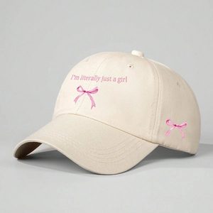 Beige cotton baseball cap featuring I'm literally just a girl text and pink bows
