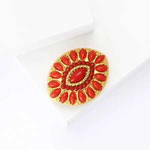 Elegant gold Turkish brooch with central red teardrop gemstone and rhinestone accents