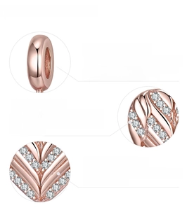 Macro view of rose gold 925 silver charm with cubic zirconia stones and plated finish
