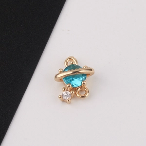 Detail showing gold-plated planet connector with blue zircon for DIY jewelry making