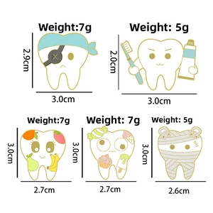 Detailed view of five creative cartoon tooth pins showing precise sizes and weight specs