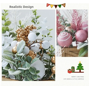 Close-up of mini Christmas tree with flocked leaves and pink ornaments in wooden box