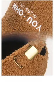 Detail of brown faux shearling baseball cap with embroidery and adjustable metal buckle