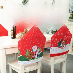 Detailed view of red Christmas chair covers with festive Santa and snowman illustrations