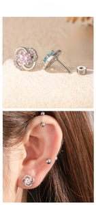 Macro detail of clover earrings with colorful zircons and secure screw back closure