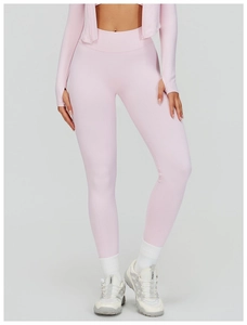 Close-up of pink seamless ribbed fabric showing elastic texture of the yoga set