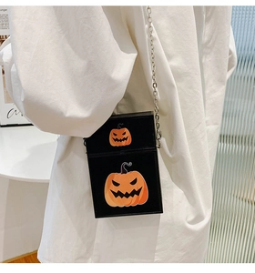 Crossbody phone bag featuring Halloween Jack-o'-lantern print and silver metal chain strap