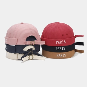 Close-up of cotton Miki hats in six colors with PARIS embroidery and adjustable strap