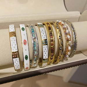 Détails de bracelets ethniques avec perles, motif œil protecteur et charmes turquoise