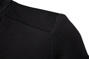 Detail of men's jacket shoulder with breathable honeycomb waffle knit texture