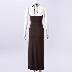 Detail view of the back of a dark brown knitted halter maxi dress on a mannequin