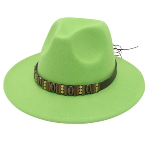 Detail of vibrant green felt fedora hat featuring a vintage leather band with metal shells