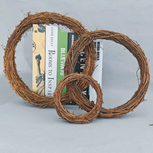 Three assorted sizes of rustic brown rattan wreaths for wedding and farmhouse decor