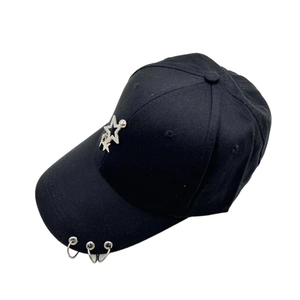Black cotton baseball cap with silver metal rings and star decoration in streetwear style
