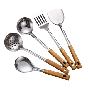 Five-piece stainless steel kitchen utensil set with ergonomic wooden handles on white background
