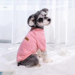 Pink knitted pet sweater for dogs featuring classic leather patch and ribbed design
